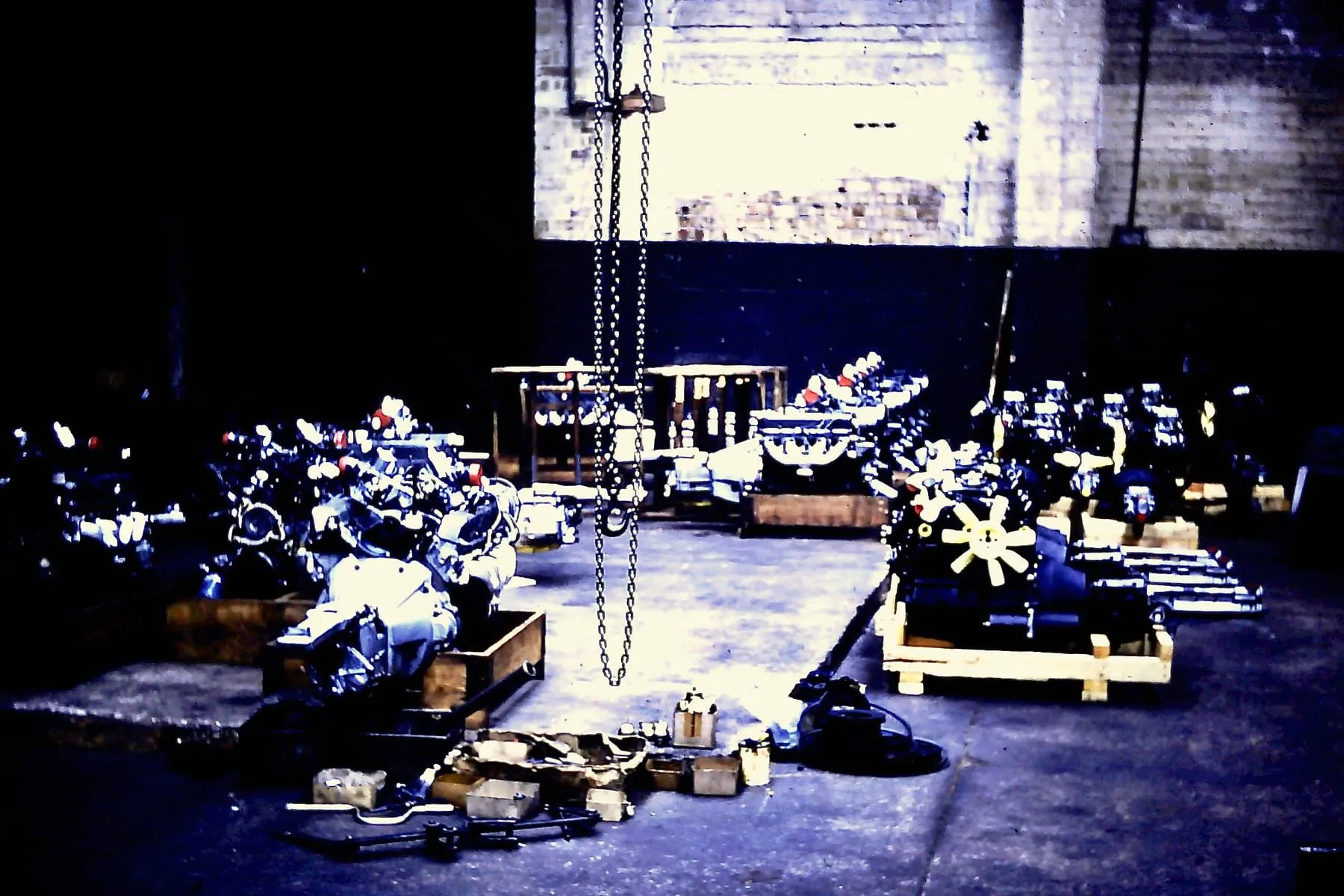 Several engines laid out on the workshop floor, waiting to be fitted to Morgans
