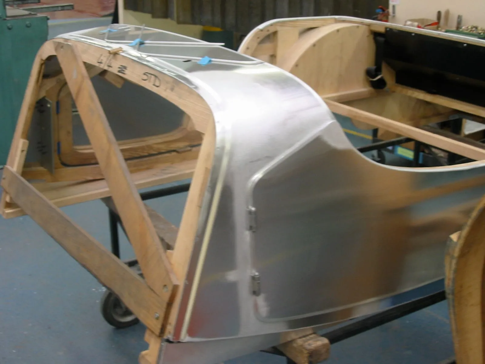 A wooden frame with an aluminium panel fitted, for a 4/4, on a trestle