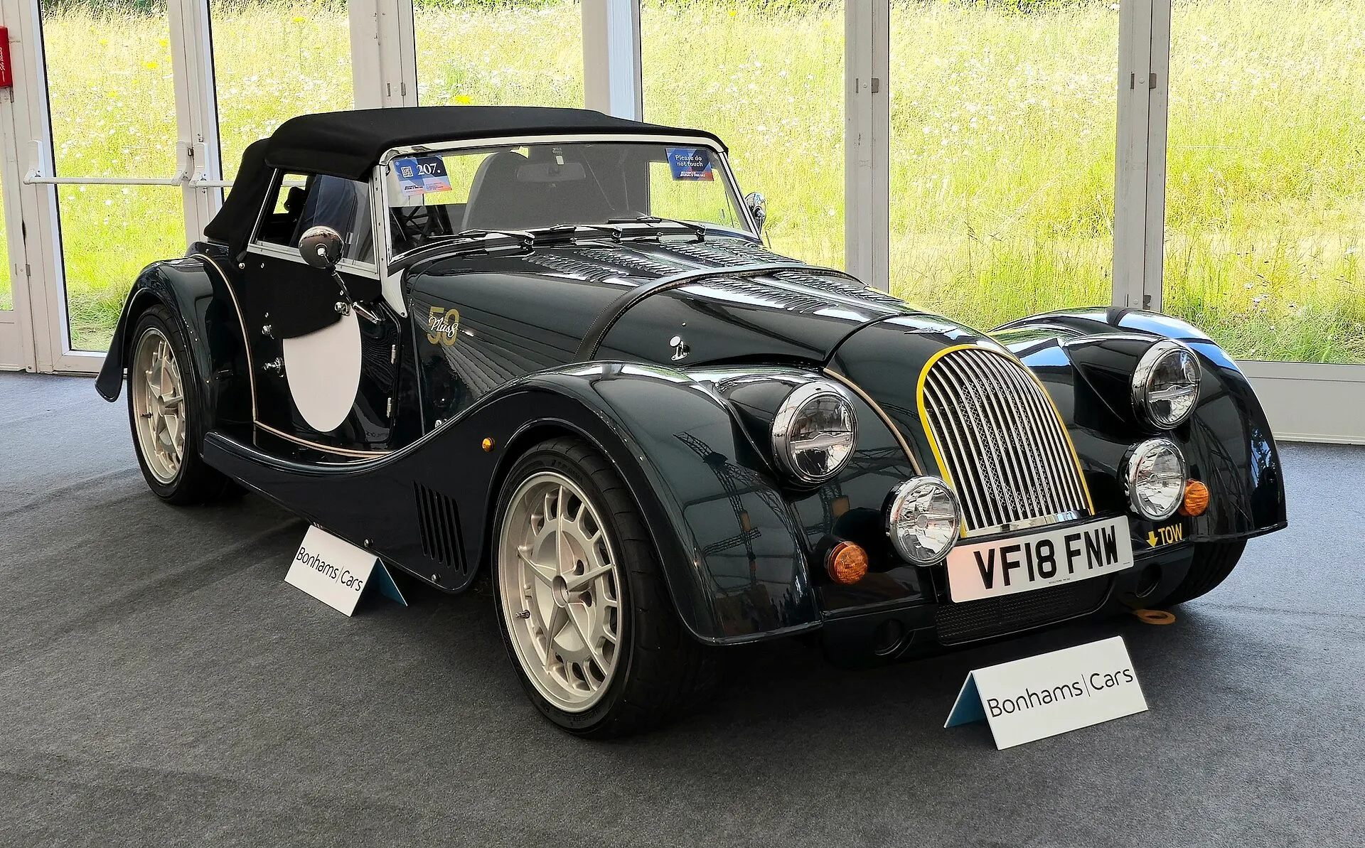 A dark-green 2018 Morgan Plus 8 50th Anniversary edition, front three-quarters